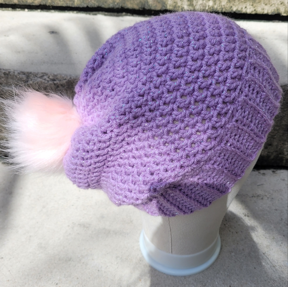 Crochet hat with faux fur pompom